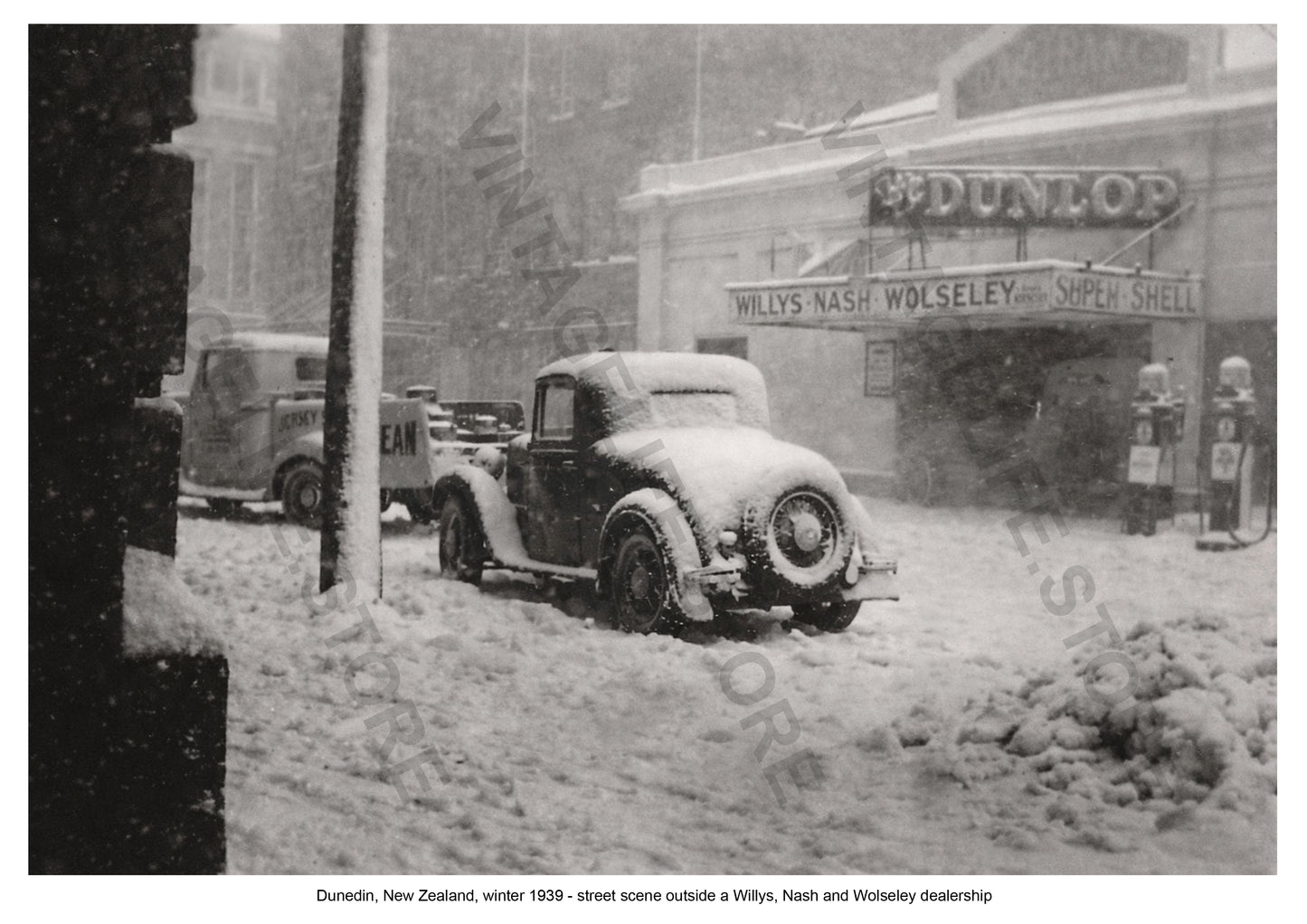 Dunedin, New Zealand, winter 1939 - street scene outside a Willys, Nash and Wolseley motor dealership