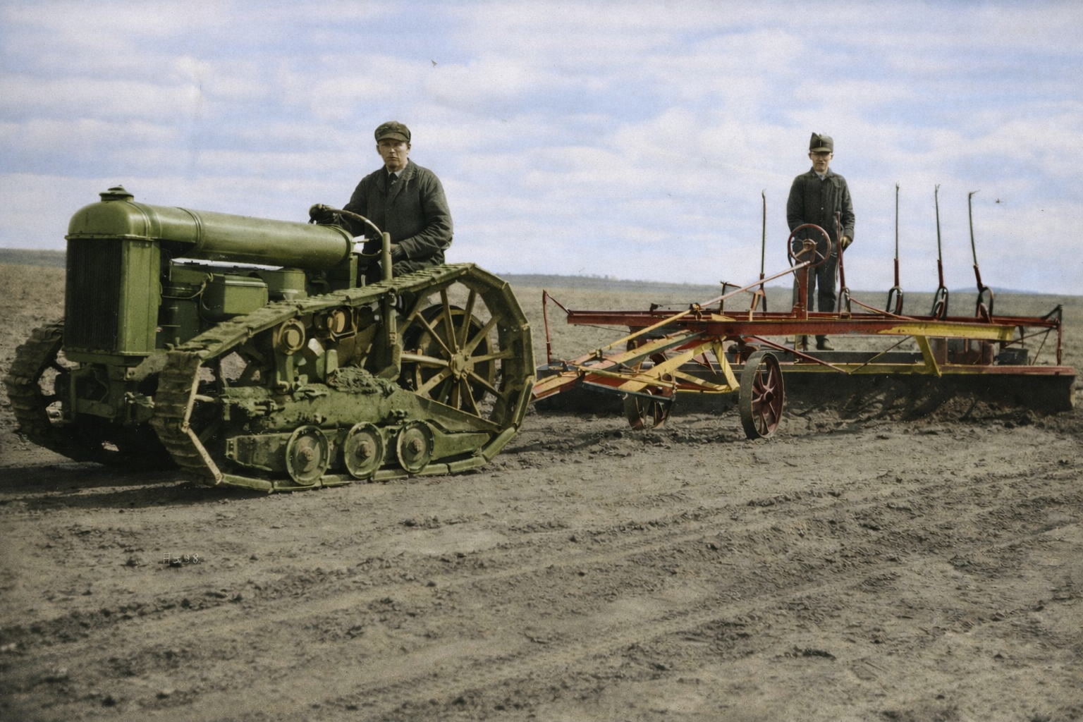 Fordson tractor pulling a plough